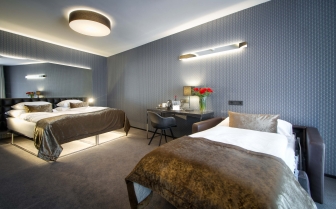 Hotel Mucha - Ttrzyosobowy pokój Deluxe